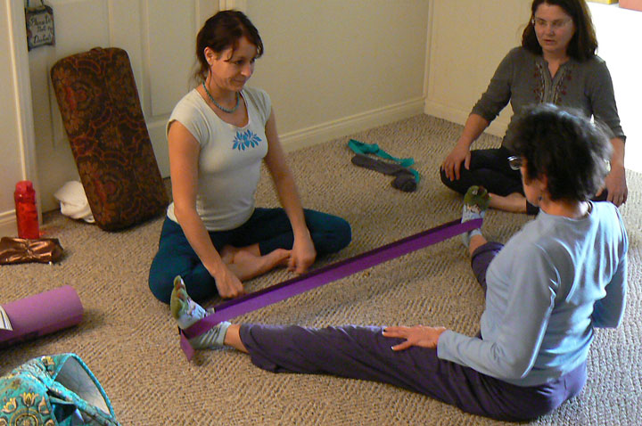 Nicole helps a student with those over-flexible hamstrings.